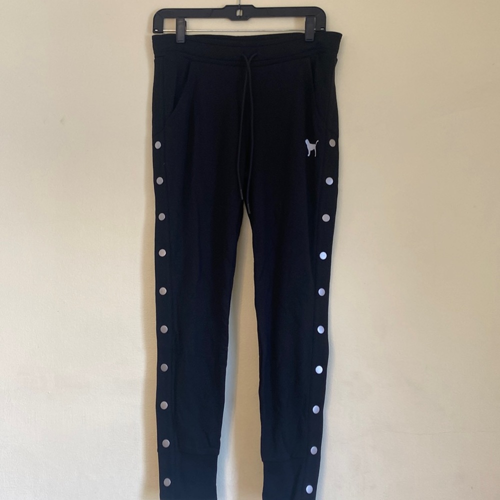 PINK skinny joggers with studs on the legs